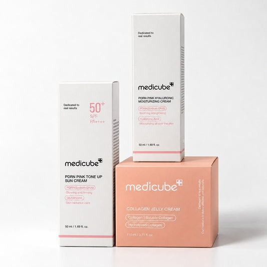 Pack Medicube : PDRN Pink Tone Up Sun Cream, PDRN Pink Hyaluronic Cream et Collagen Jelly Cream sur fond blanc